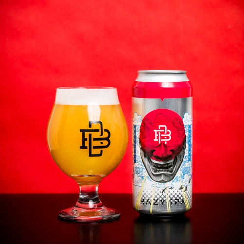 Can of Breathe Hazy IPA with a filled beer glass