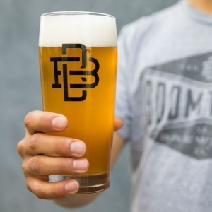 Boomtown branded glass with beer inside
